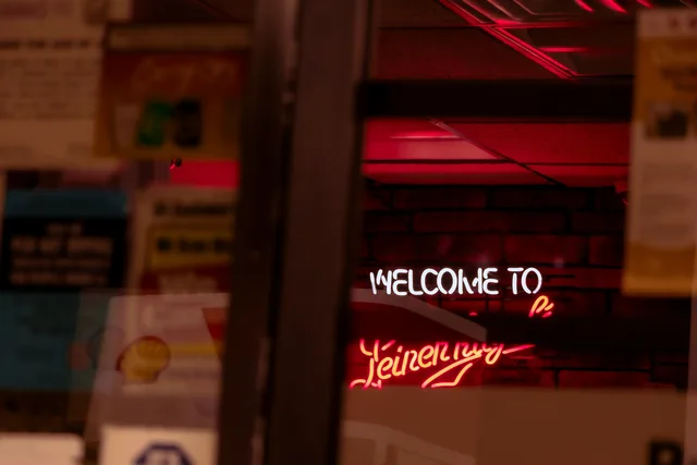 welcome to, neon in the window